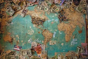 World map with banknotes. Copyright: Christine Roy on Unsplash